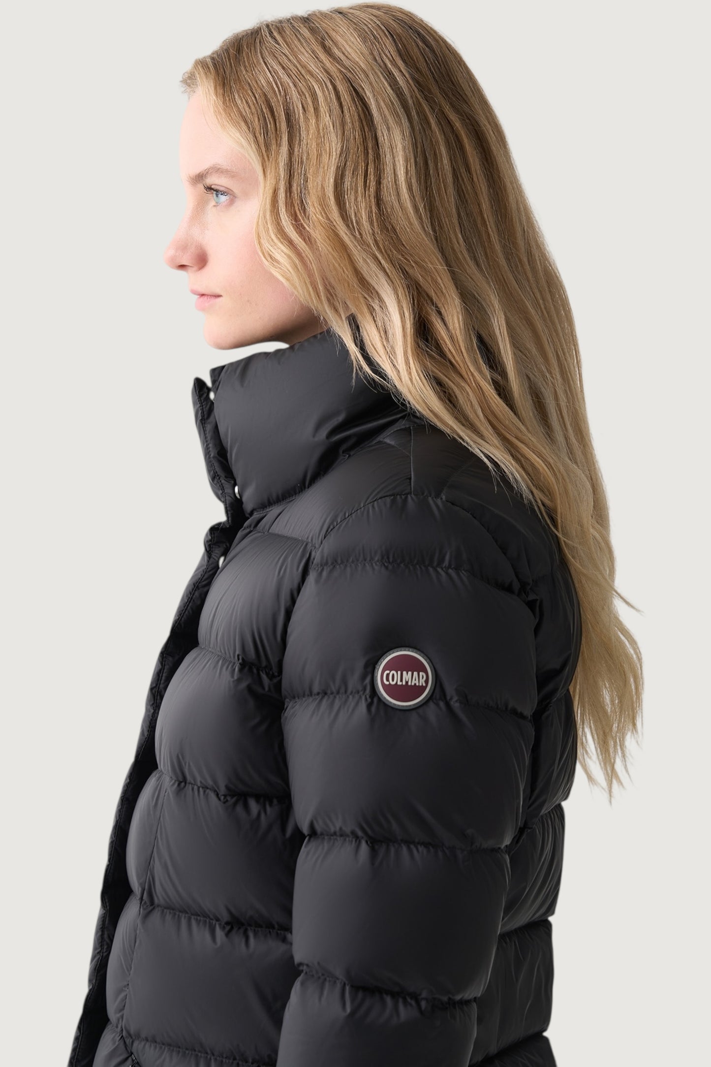 Piumino collo alto sfiancato