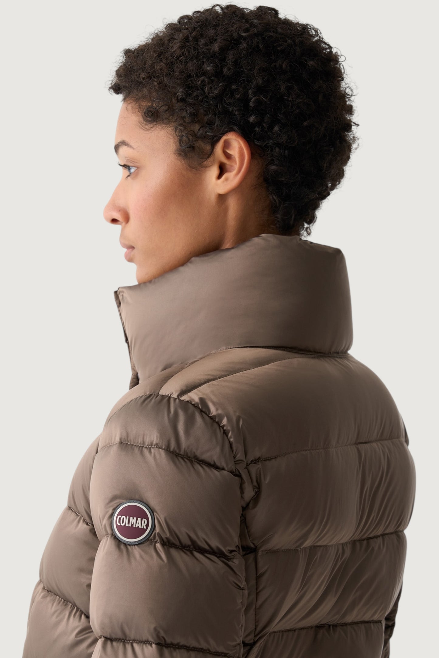 Piumino collo alto sfiancato